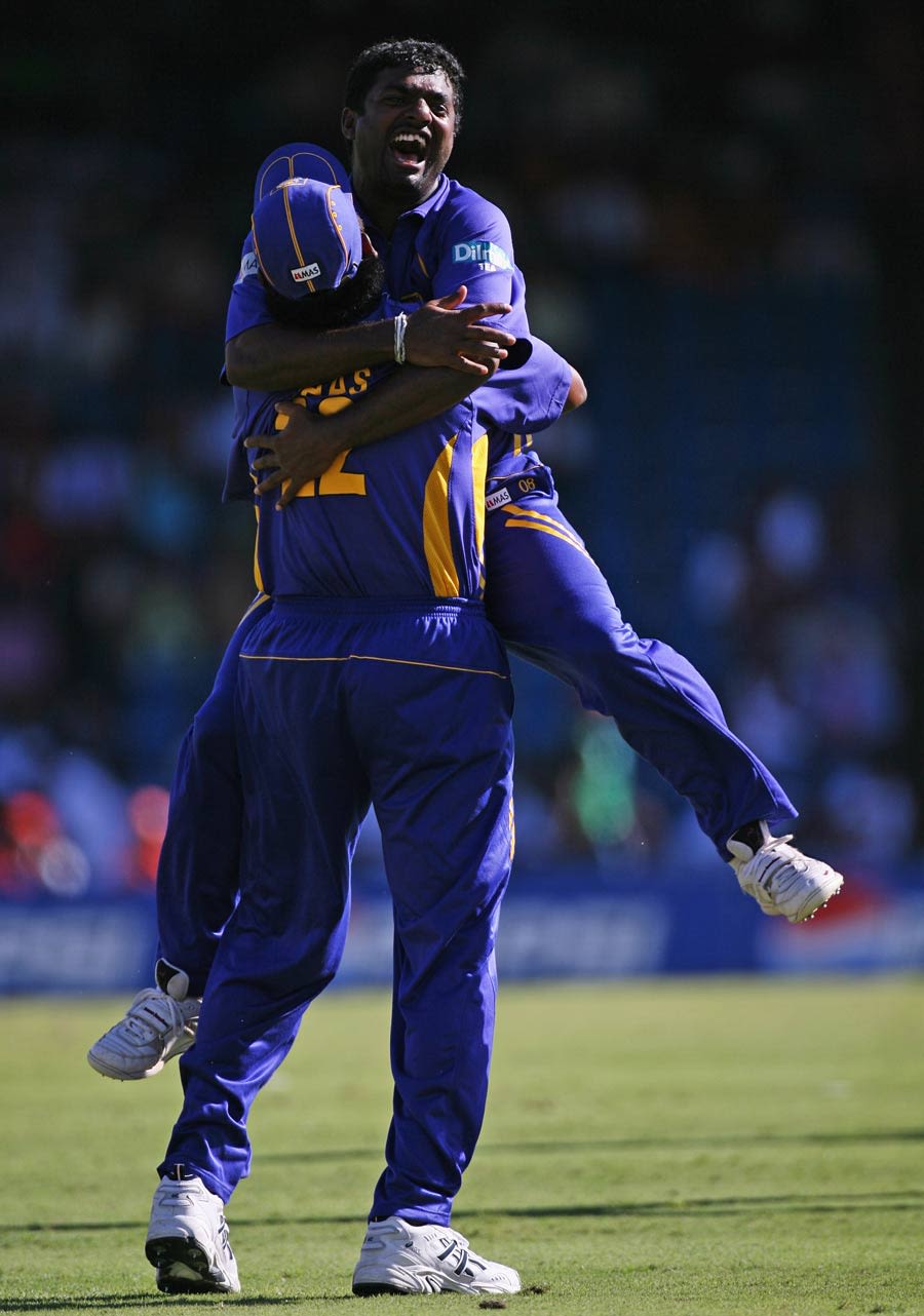 Muttiah Muralitharan And Chaminda Vaas Celebrate The Fall Of Virender