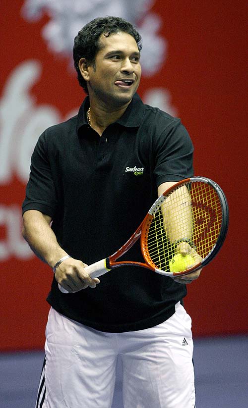 Sachin Tendulkar Prepares To Serve During An Exhibition Match