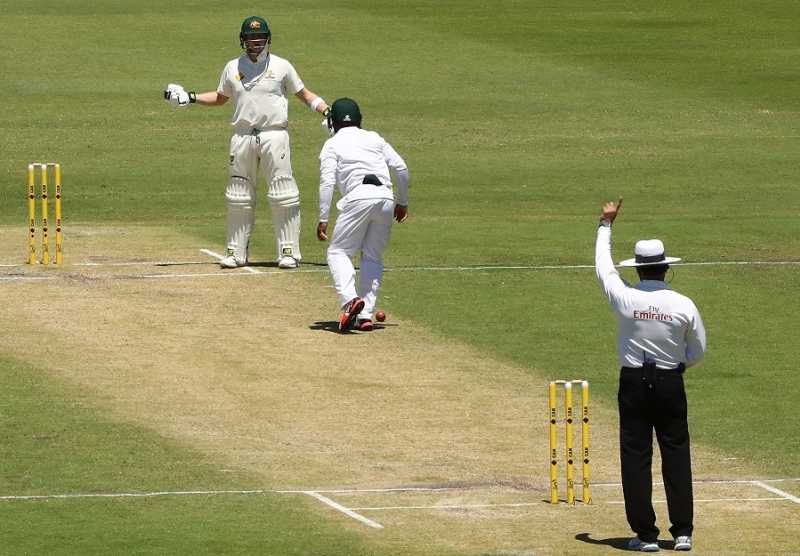 umpire waiting for batter to take strike cricket match
