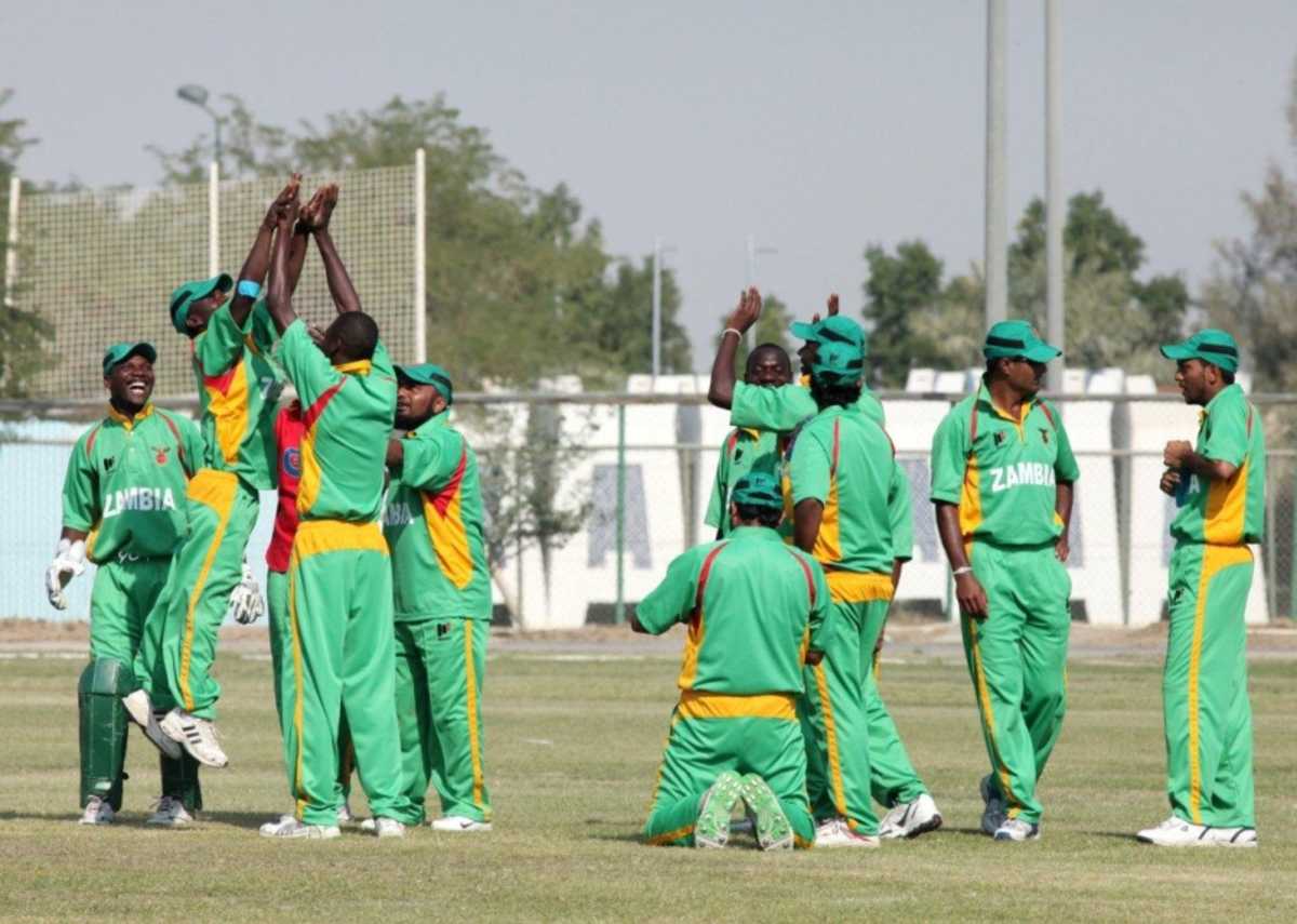 The victorious Zambians celebrate another wicket