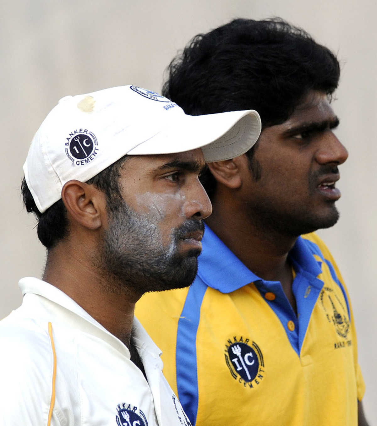 Dinesh Karthik and R Prasanna look on during practice 
