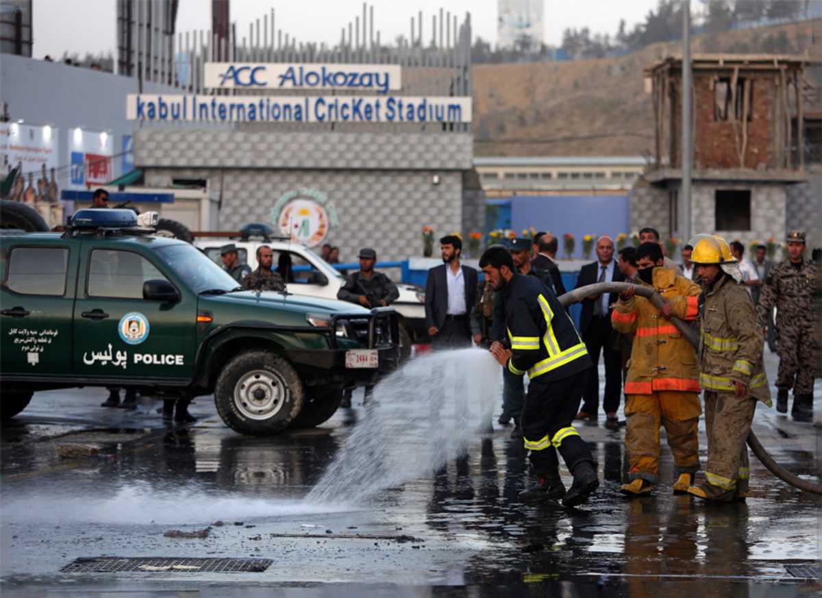 Firefighters in action outside Alokozay Kabul International Cricket Stadium
