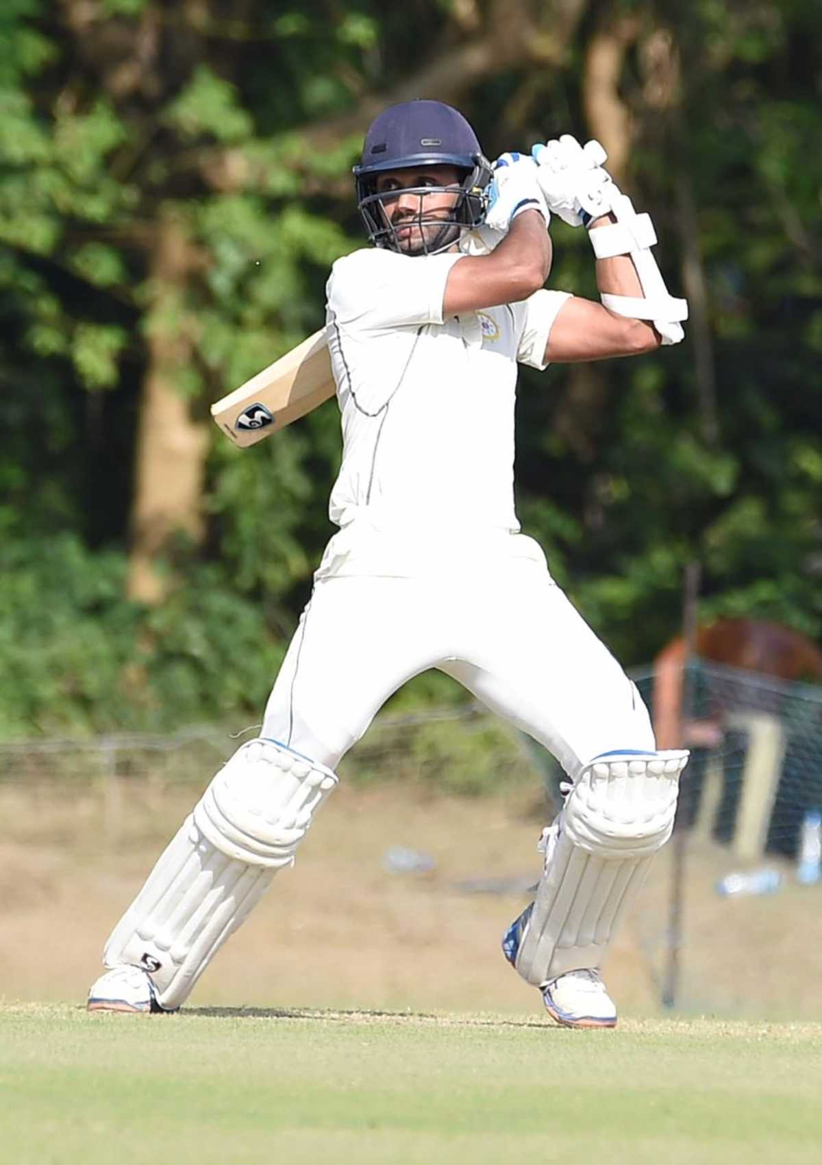 Milind Kumar plays the ball square