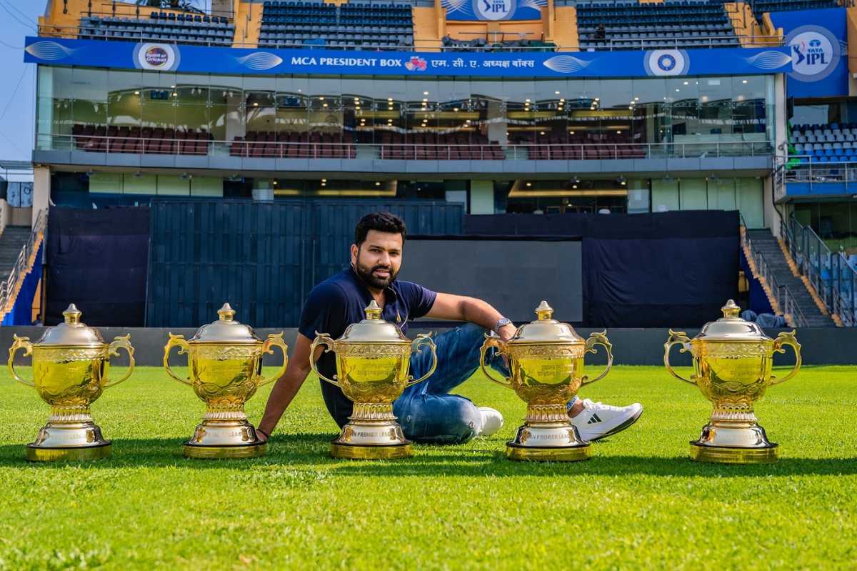 Rohit Sharma poses with the five IPL trophies he has won as Mumbai Indians captain