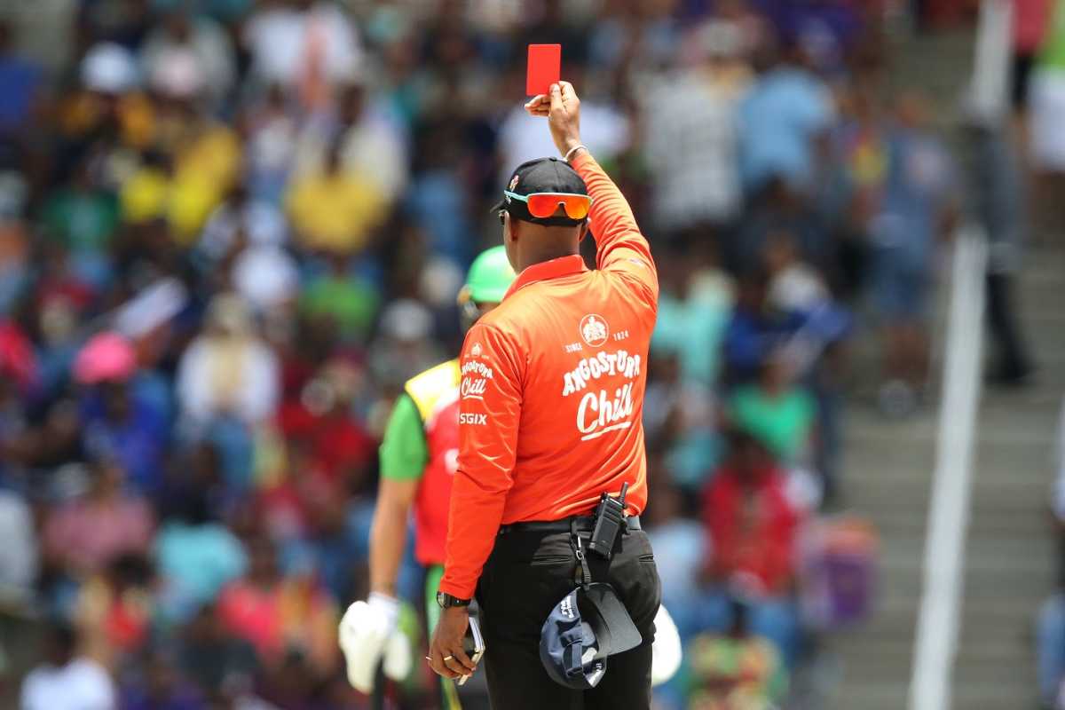 Umpire Chris Wright shows red card after Barbados Royals were behind schedule at the start of the 20th over, Guyana Amazon Warriors vs Barbados Royals, CPL 2023, Tarouba, September 10, 2023