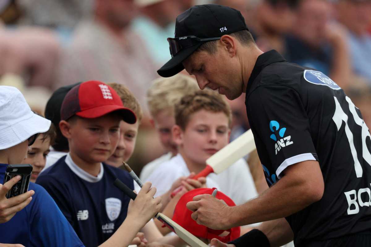 Trent Boult signs autographs during a break in play at the Ageas Bowl