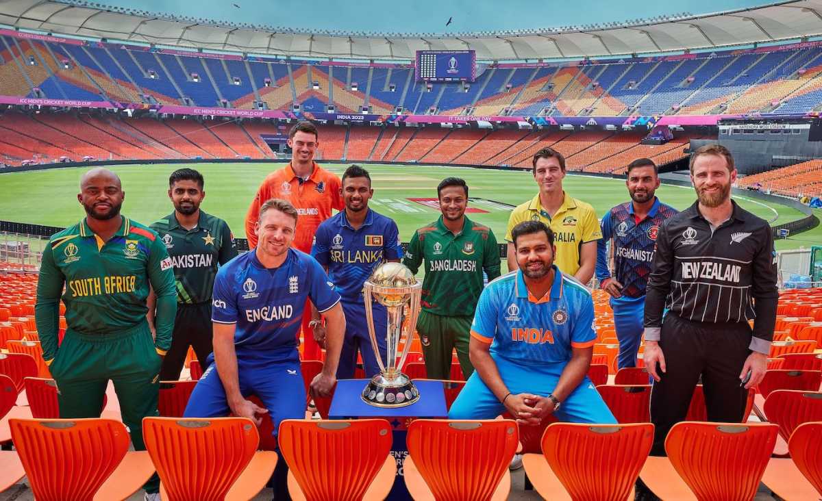 The 10 team captains pose with the World Cup trophy