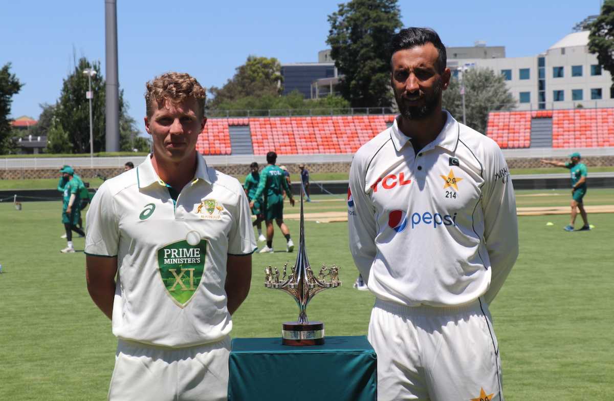 Prime Minister's XI captain Nathan McSweeney and Pakistan captain Shan Masood with the warm-up game trophy, Canberra, December 5, 2023