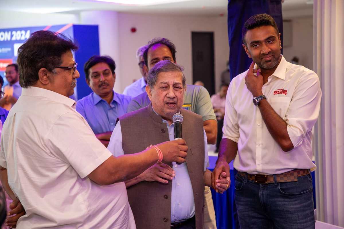 N Srinivasan, flanked by R Ashwin to his left, speaks at the TNPL auction, Chennai, February 7, 2024