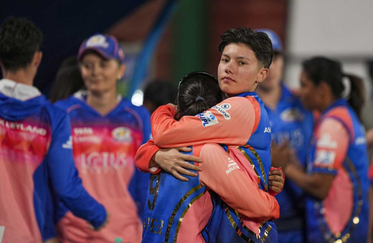 Issy Wong consoles a team-mate after Mumbai's elimination, Mumbai Indians vs Royal Challengers Bangalore, WPL, Eliminator, Delhi, March 15, 2024 