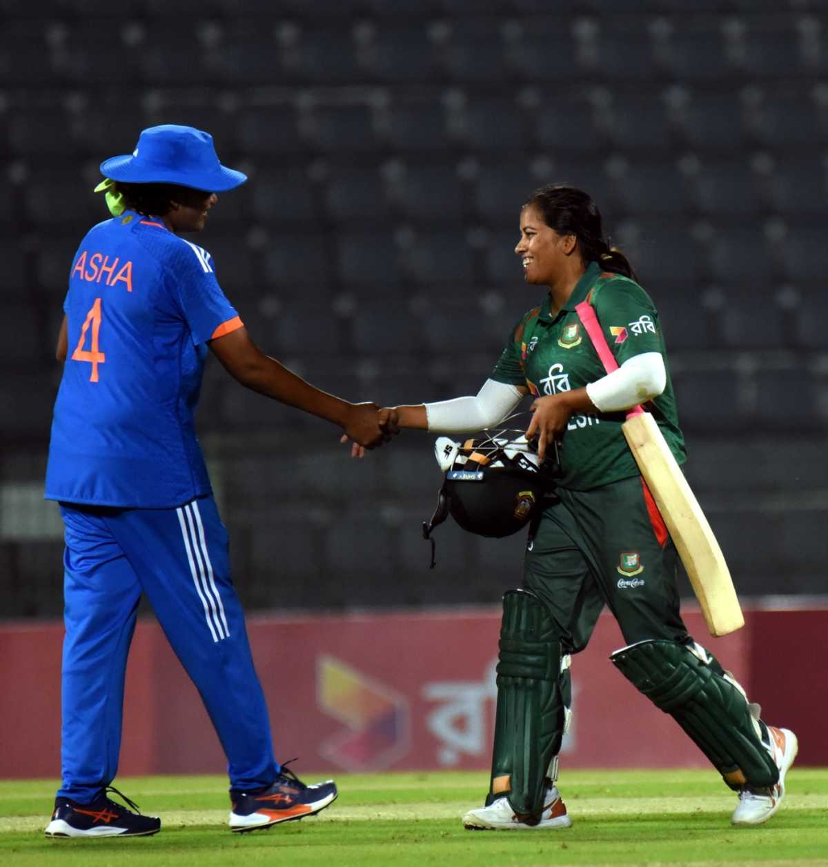Debutant S Asha, who finished with 2 for 18, shakes hands with Nahida Akter, Bangladesh vs India, 4th women's T20I, Sylhet, May 6, 2024
