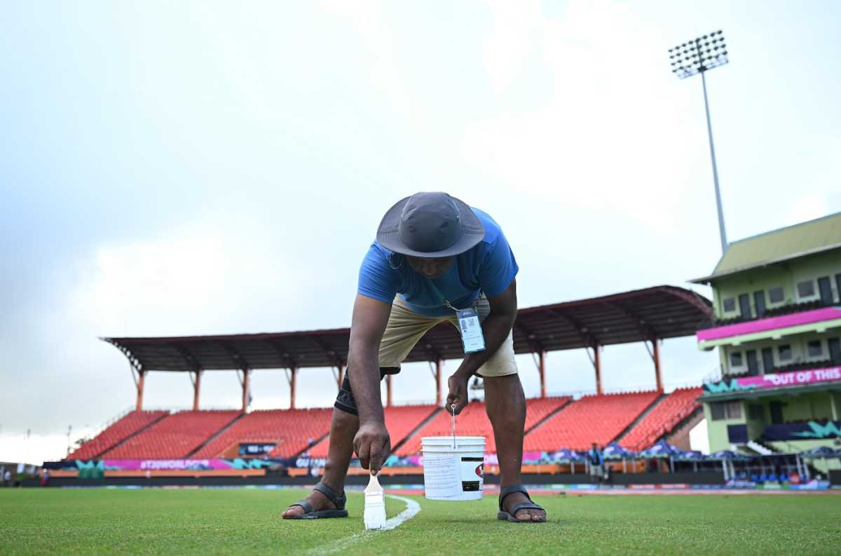 A groundsman paints the inner circle on the field, England vs India, T20 World Cup semi-final, Providence, Guyana, June 27, 2024