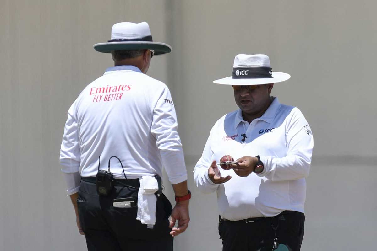 Umpire Ahsan Raza inspects the ball, West Indies vs South Africa, 1st Test, Port-of-Spain, day 3, August 9, 2024
