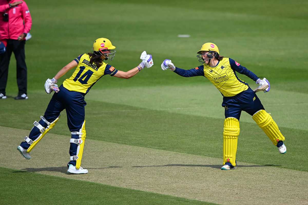 Maia Bouchier and Ella McCaughan punch gloves during their stand, Hampshire vs Essex, Women's T20 Blast, Utilita Bowl, May 30, 2025