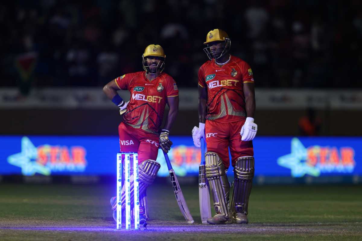 Nicholas Pooran and Andre Russell wait as a floodlight failure brings a pause in play, Trinbago Knight Riders vs Barbados Royals, Eliminator, CPL 2024, October 1, 2024