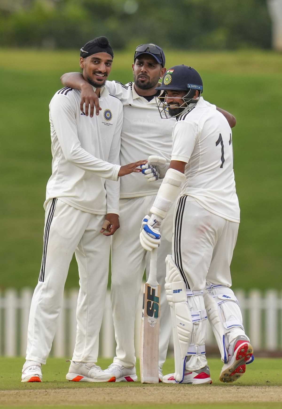 India fast bowlers Arshdeep Singh, Harshit Rana and Mohammed Shami share a light moment during a Duleep Trophy match, North Zone vs East Zone, Duleep Trophy, Quarter-final, BCCI CEG Ground, August 29, 2025