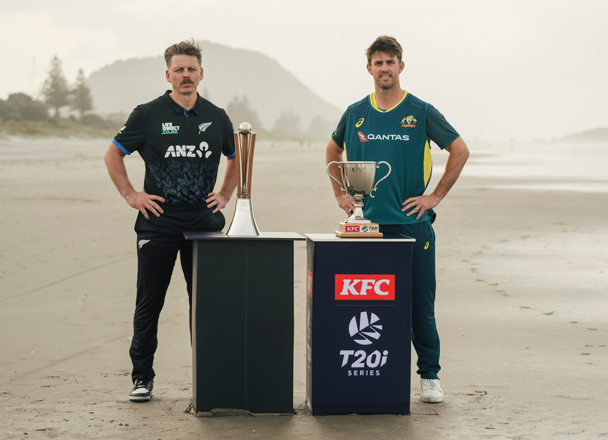Michael Bracewell and Mitchell Marsh pose with the Chappell-Hadlee and T20I series trophies, Mount Maunganui, September 28, 2025