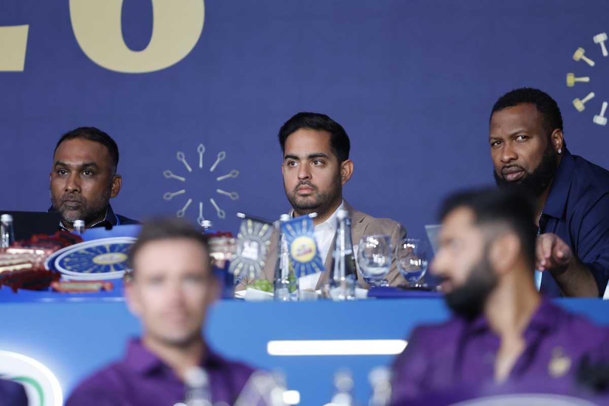 The Mumbai Indians (MI) table - head coach Mahela Jayawardene, co-owner Akash Ambani and batting coach Kieron Pollard look on, Abu Dhabi, December 16, 2025