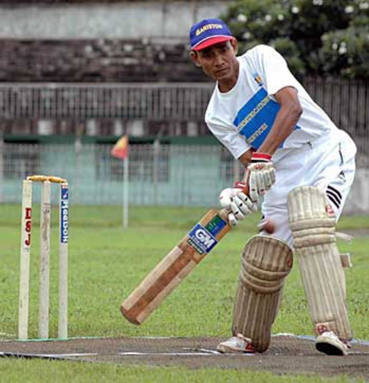 Players of the Myanmar cricket federation practise at the Yangon stadium, August 28, 2005