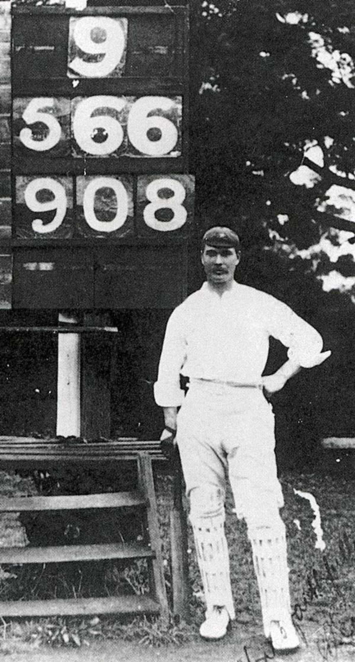 Charles Eady next to the scoreboard after his remarkable innings