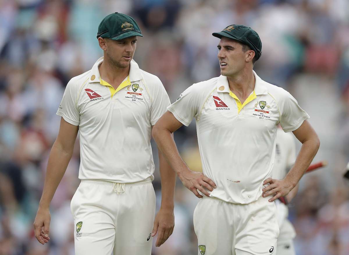 Josh Hazlewood and Pat Cummins of Australia walk from the ground at lunch | ESPNcricinfo.com