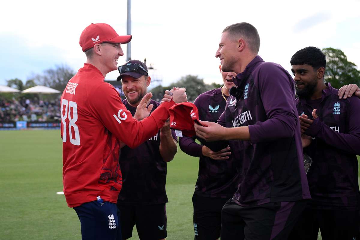 Brydon Carse presents Harry Brook with his 50th T20I cap