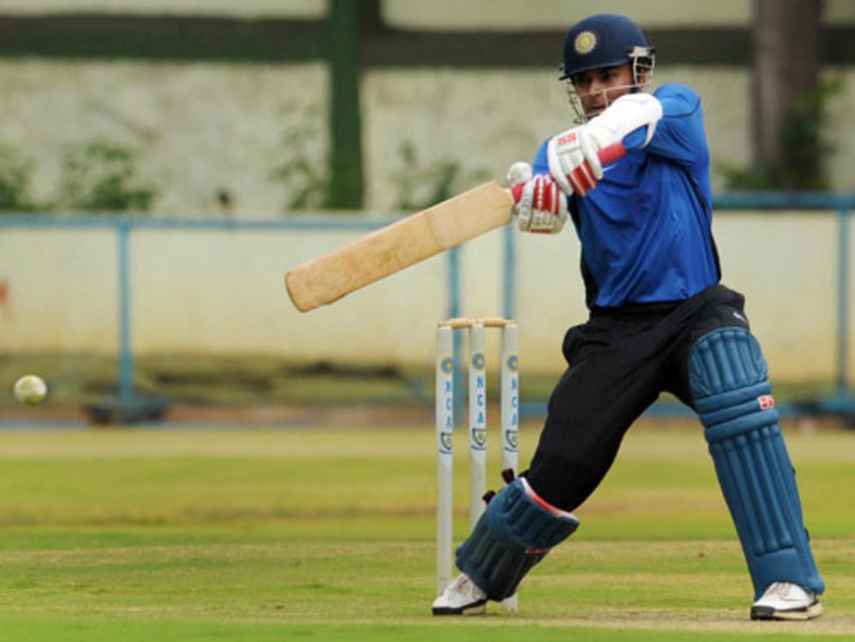 S Badrinath cuts during a practice session