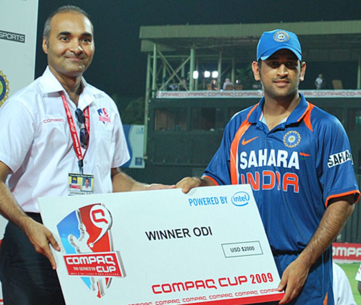 ms-dhoni-is-presented-with-the-winning-team-s-cheque-espncricinfo