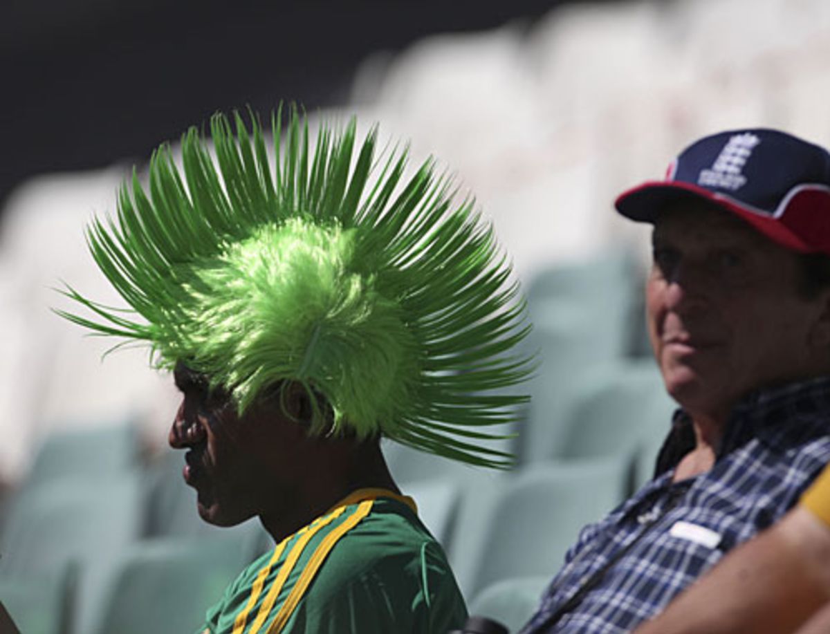A fan sports an outlandish wig