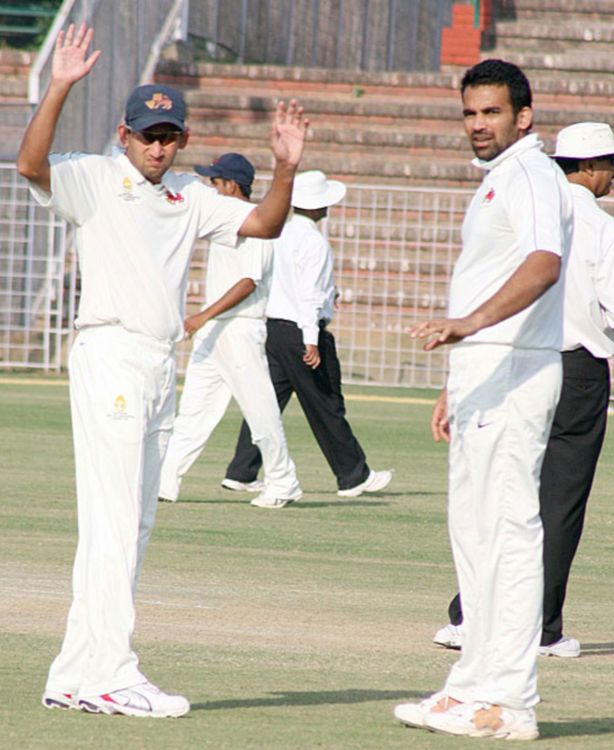 Ajit Agarkar and Zaheer Khan await the resumption of Punjab's second