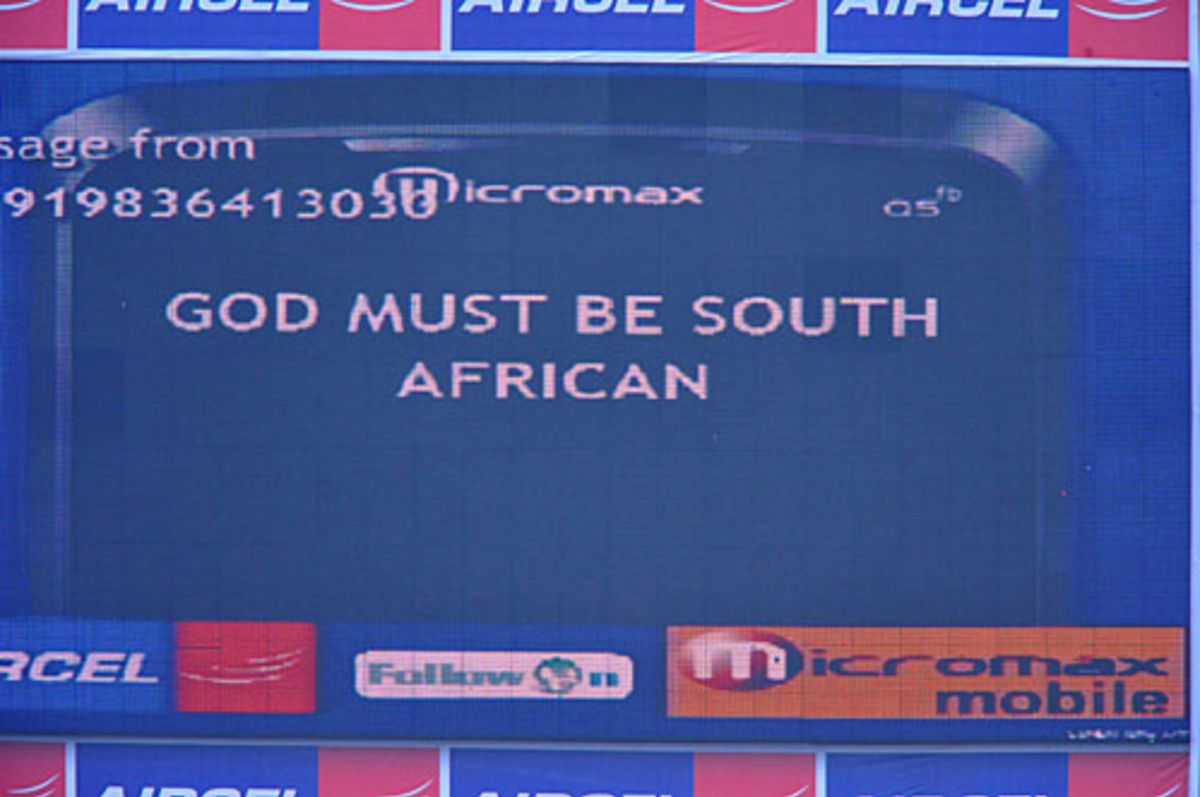 A fan message flashes on the scoreboard after rain intervenes play
