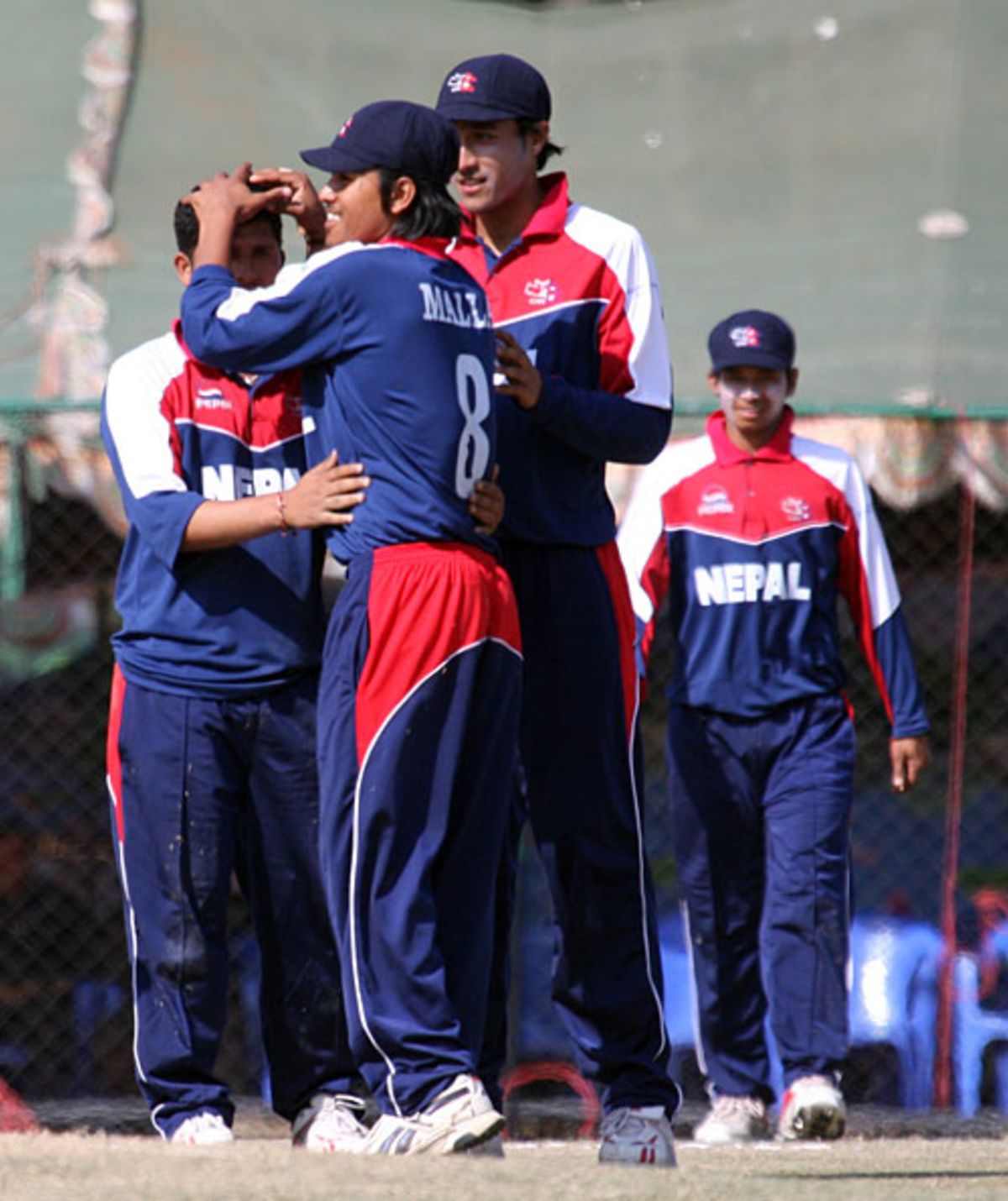 Basanta Regmi is congratulated by Gyanendra Malla and Paras Khadka, Nepal v Fiji, ICC World Cricket League Division Five, Kirtipur, February 24, 2010