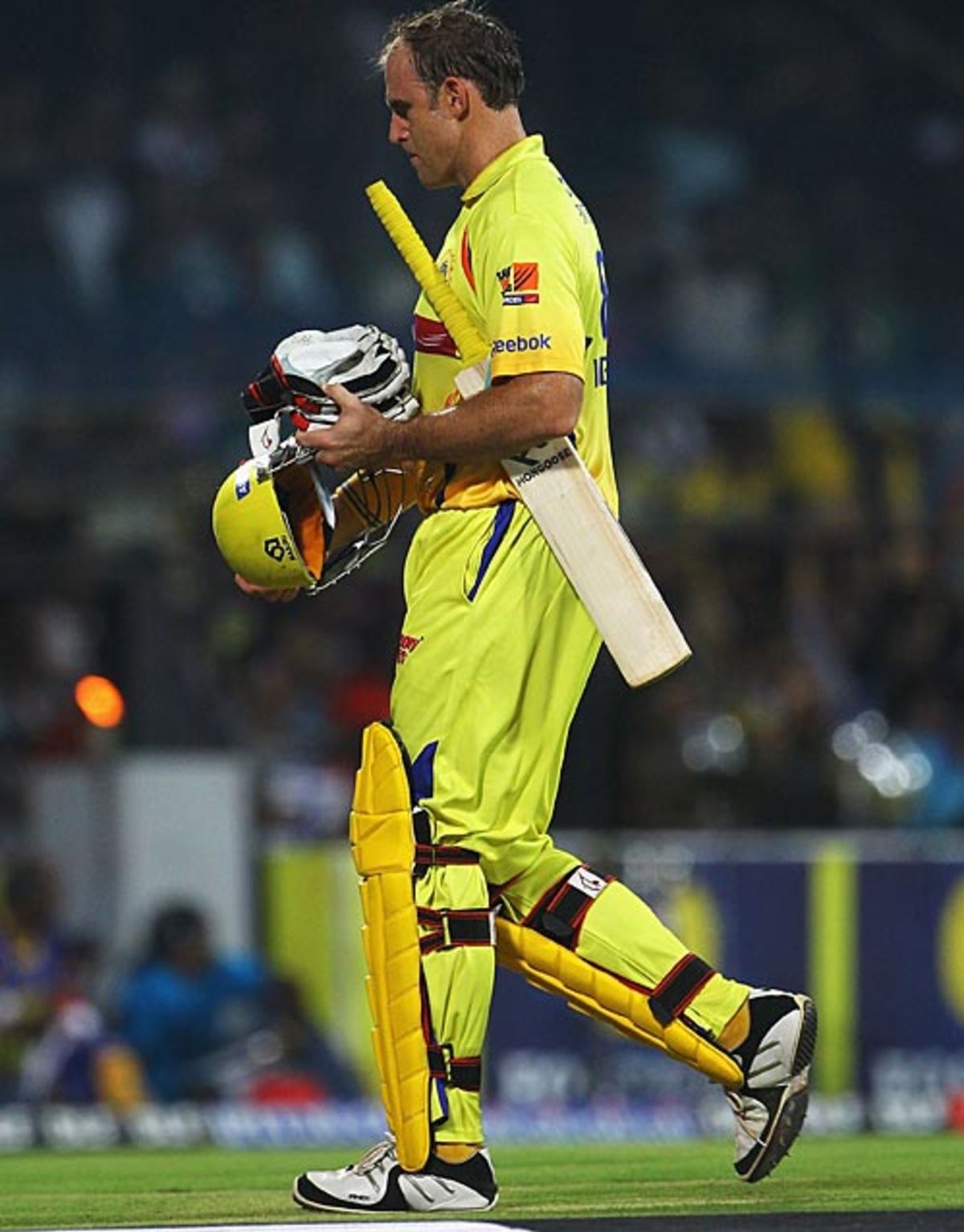 Matthew Hayden walks back after his dismissal