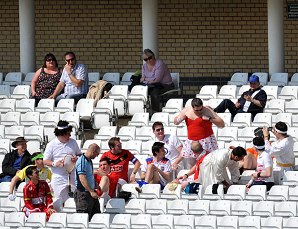 Cricket fans in fancy dress in the stands