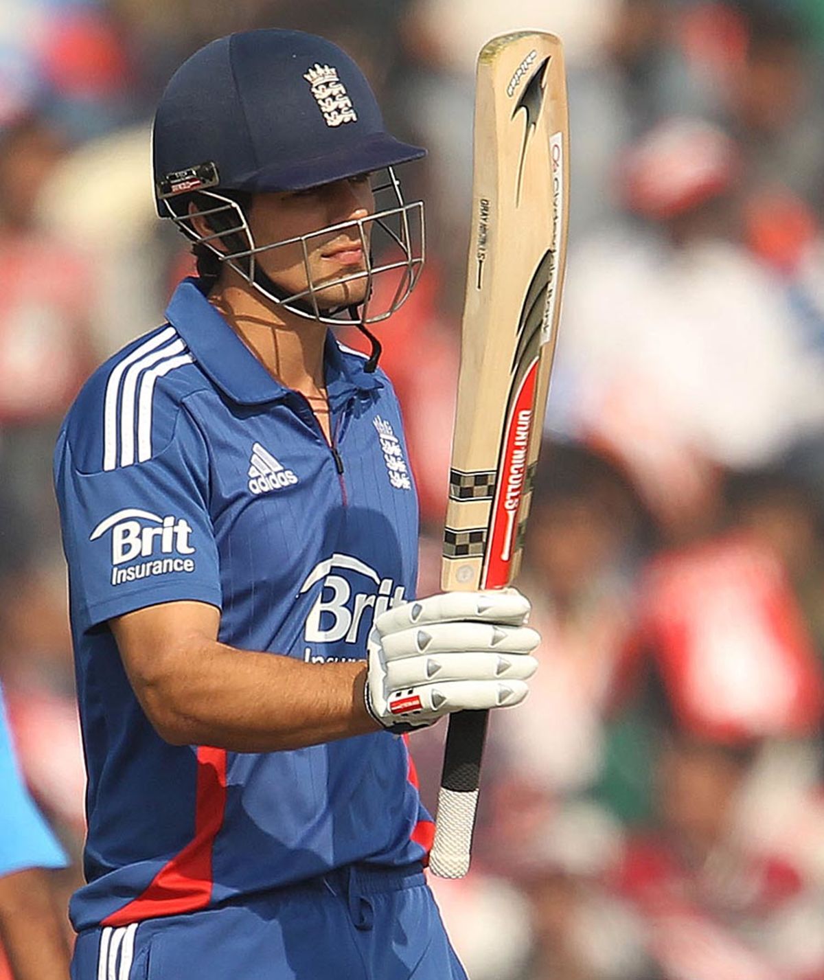 Alastair Cook raises hit bat after scoring a patient half-century, India v England, 4th ODI, Mohali, January 23, 2013