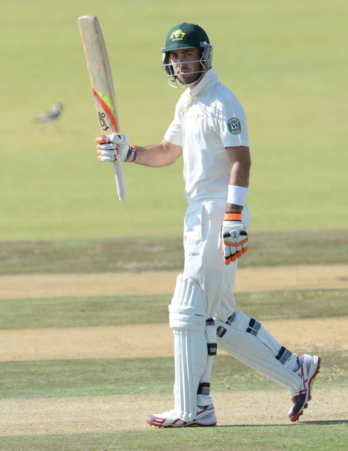 Glenn Maxwell raises his bat after