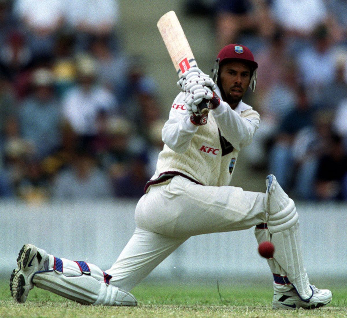 West Indies captain Jimmy Adams sweeps against the Prime Ministers XI ...