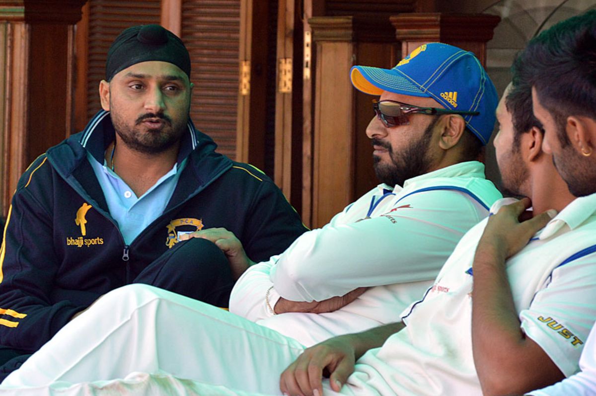 Punjab captain Harbhajan Singh has a chat in the dressing room |  