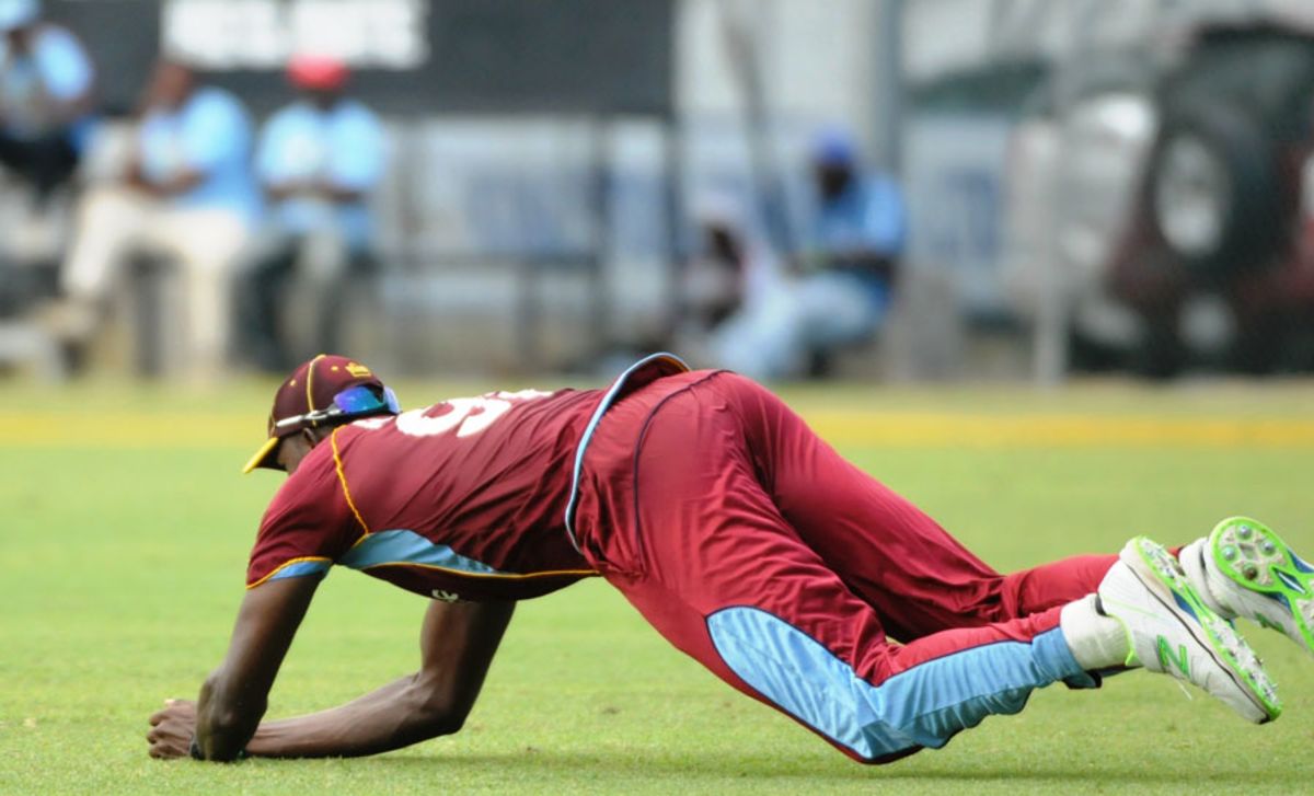 Jason Holder takes a diving catch