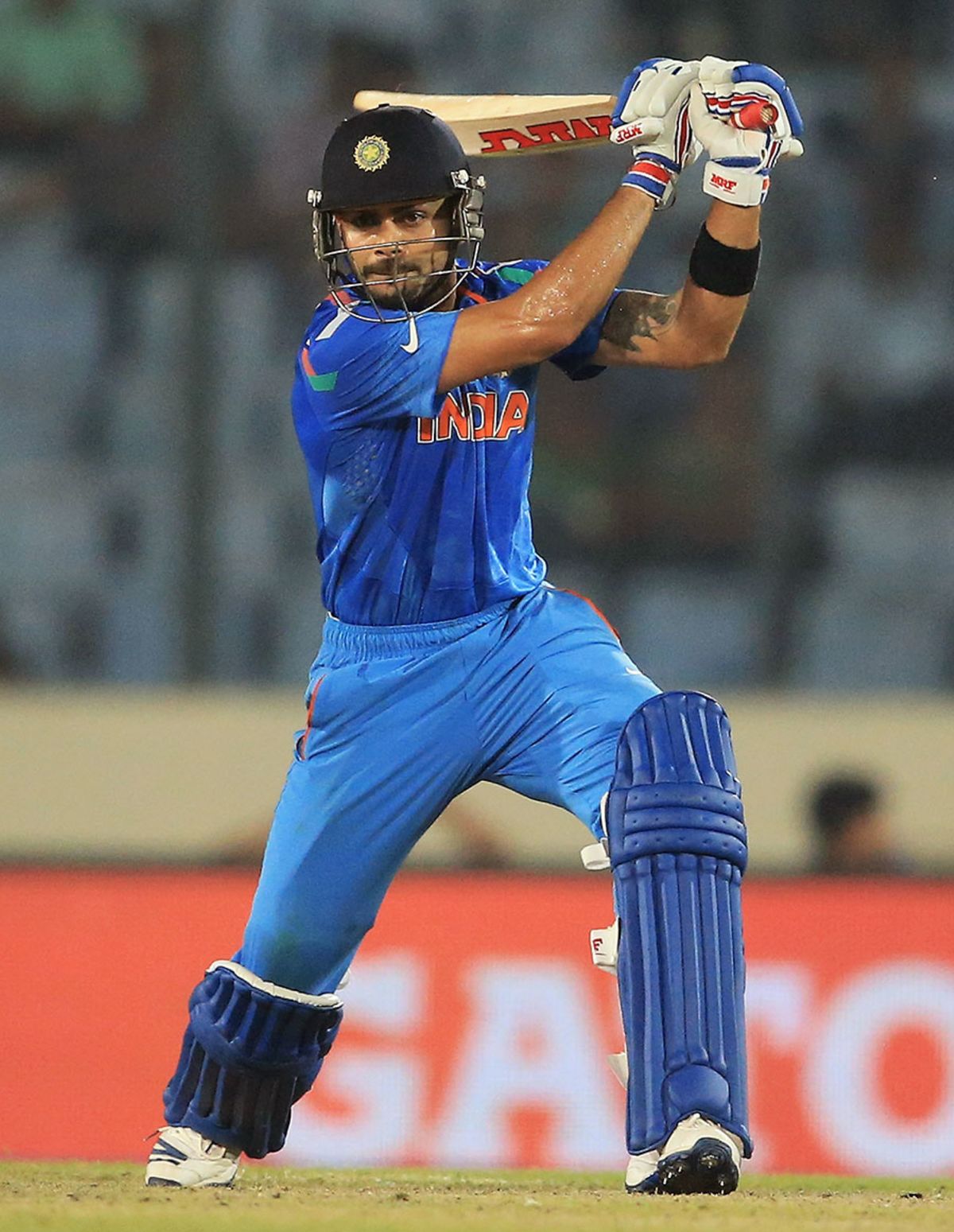 Virat Kohli powers the ball through the off side, India v West Indies, World T20, Group 2, Mirpur, March 23, 2014