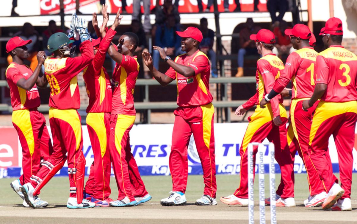 Zimbabwe players celebrate the dismissal of Kedar Jadhav, Zimbabwe v India, 1st ODI, Harare, July 10, 2015