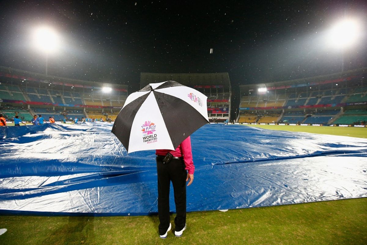 A match official inspects the ground during a rain break, Hong Kong v Scotland, World T20 qualifiers, Group B, Nagpur, March 12, 2016