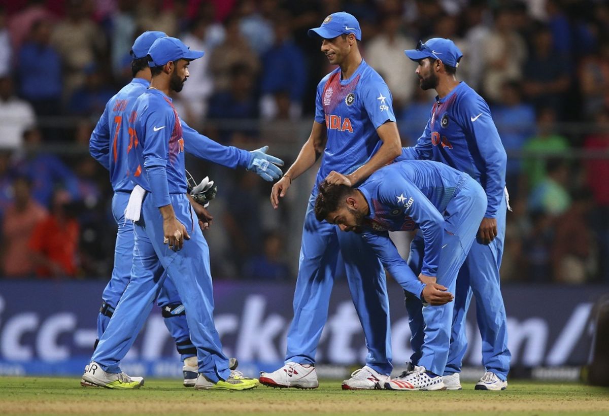 Virat Kohli is consoled by Ashish Nehra after India's loss, India v West Indies, World T20 2016, semi-final, Mumbai, March 31, 2016