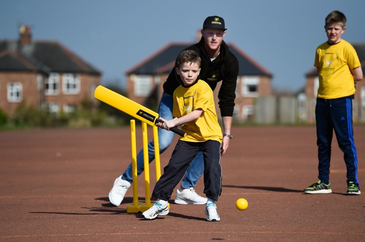 Charlie Darwood from Ravenswood primary school bowls as Ben Stokes and ...