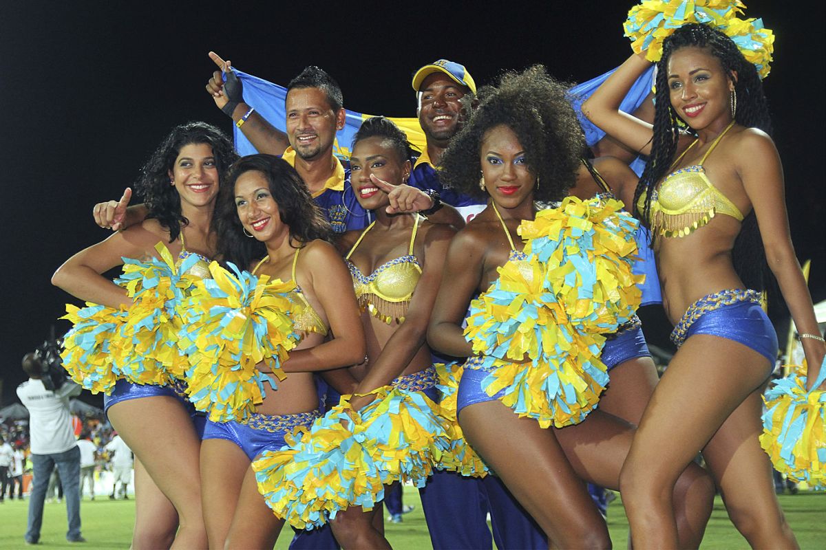 Dwayne Smith and Rayad Emrit celebrate Barbados' win with cheerleaders, Barbados Tridents v Guyana Amazon Warriors, CPL 2014 final, St Kitts, August 16, 2014