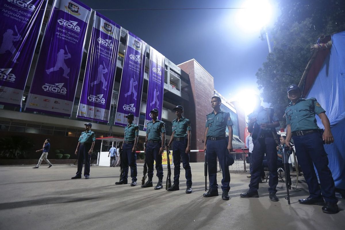 Bangladeshi police officials stand guard outside the Sher-e-Bangla Stadium, Bangladesh v Afghanistan, 2nd ODI, Mirpur, September 28, 2016