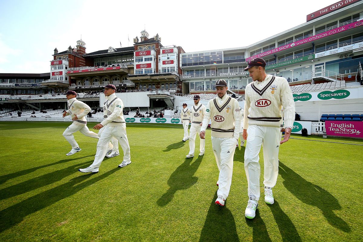 Surrey's players walk onto The Oval, Surrey v Essex, County Championship, Division One, The Oval, April 13, 2019