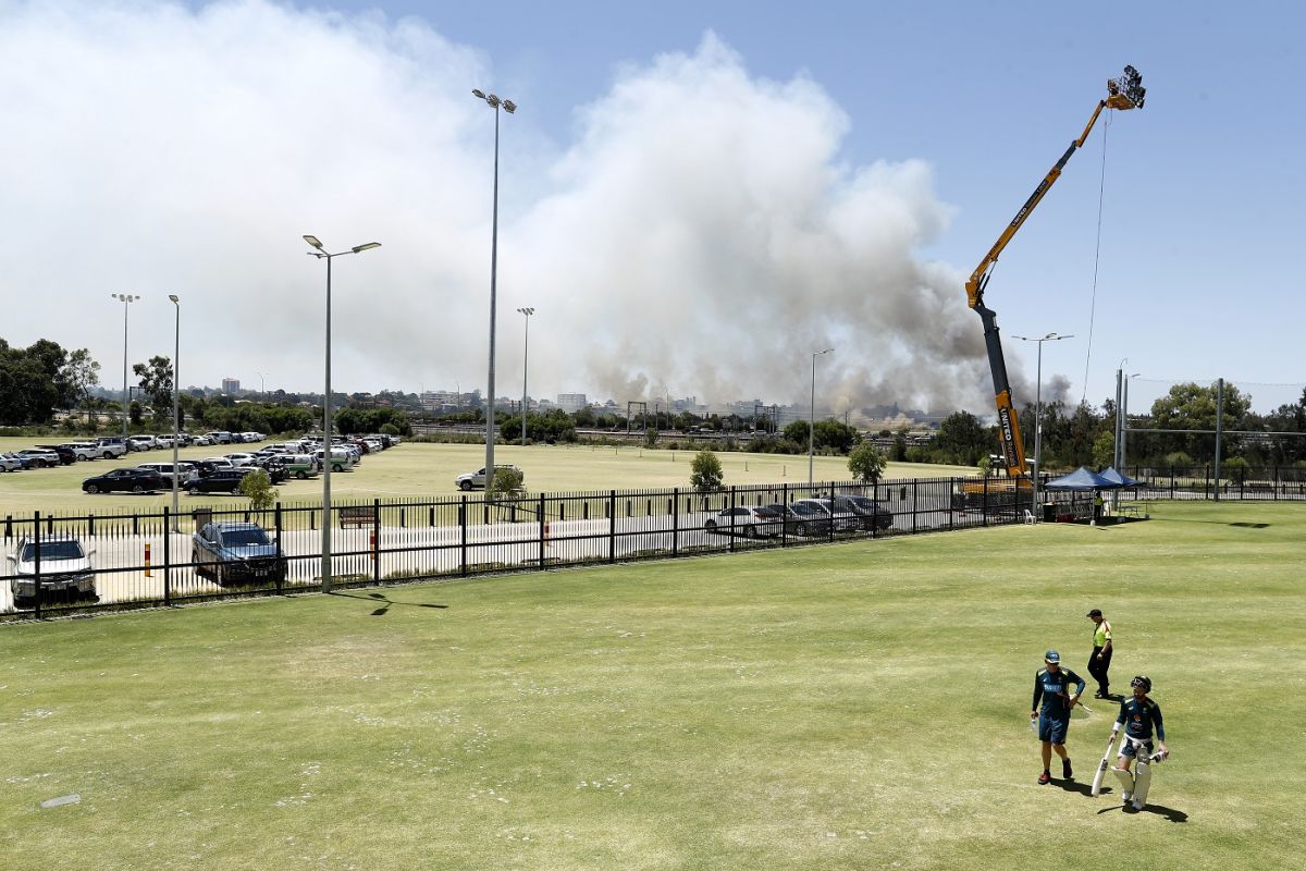 Smoke from a grass fire at Belmont Park Racecourse, near the Optus Stadium