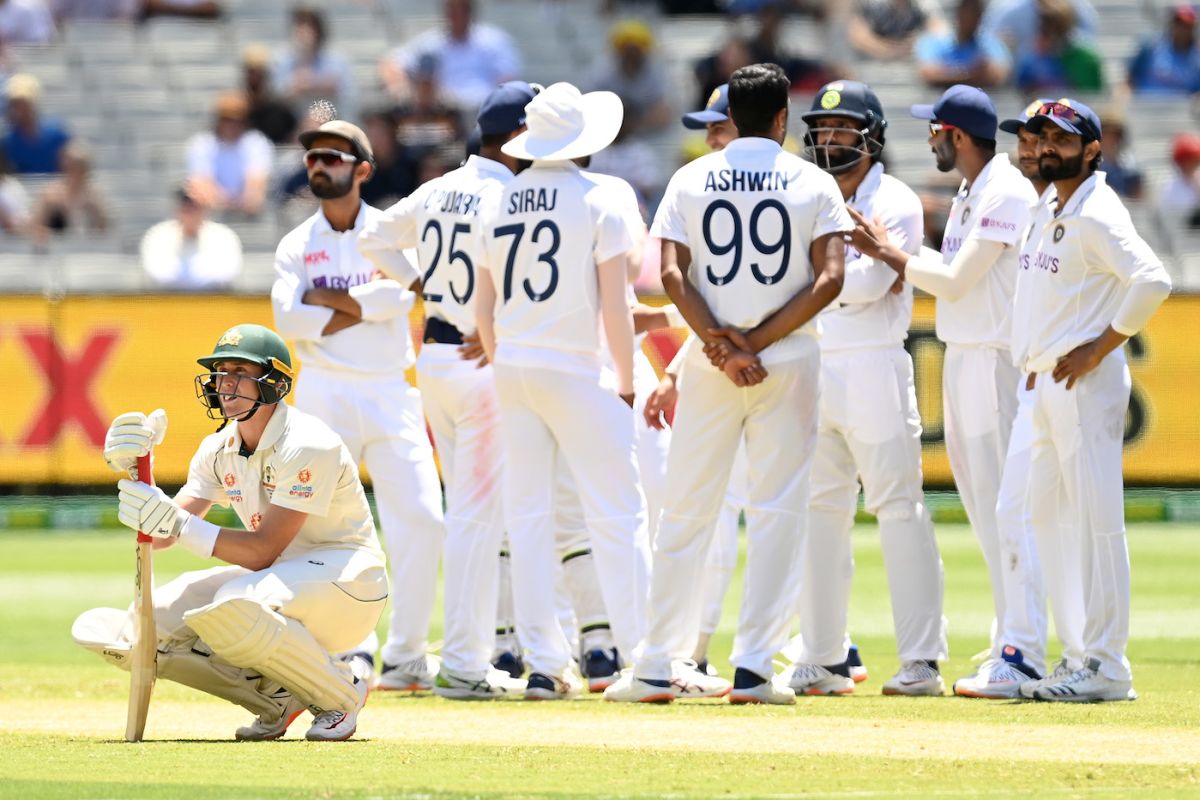 Marnus Labuschagne and the India players wait for a review decision ...