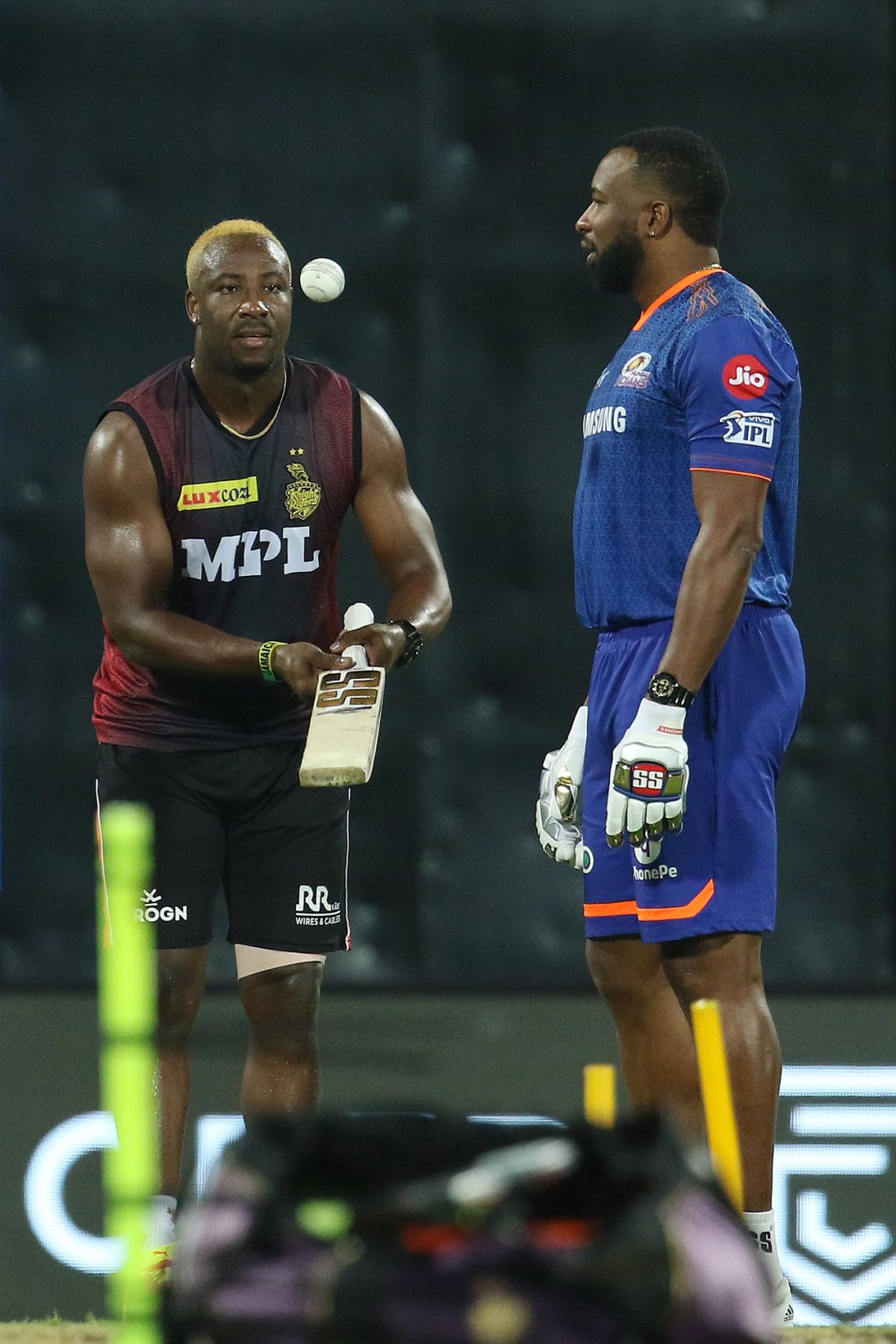 Andre Russell and Kieron Pollard have a chat ahead of the game